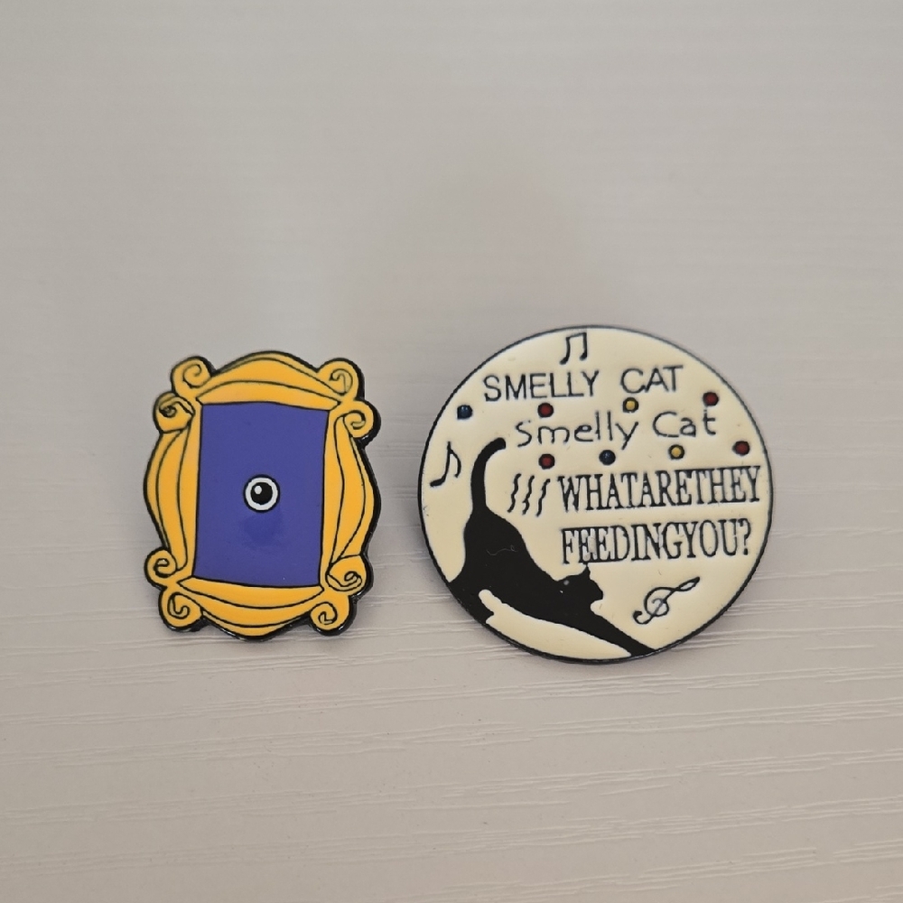 Yellow and Black Enamel Pin Set with Iconic Frame Design